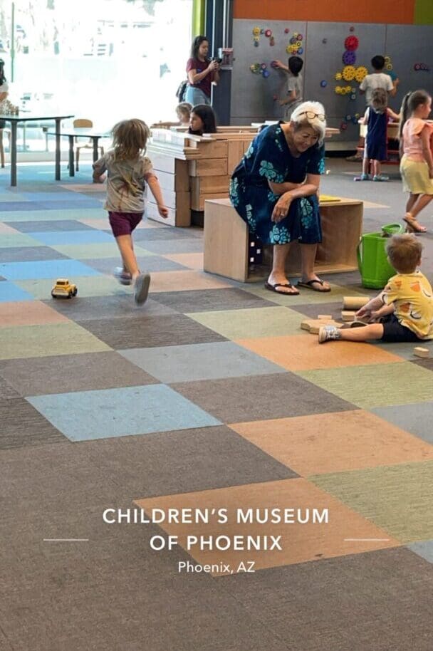 A group of children playing in an indoor play area.