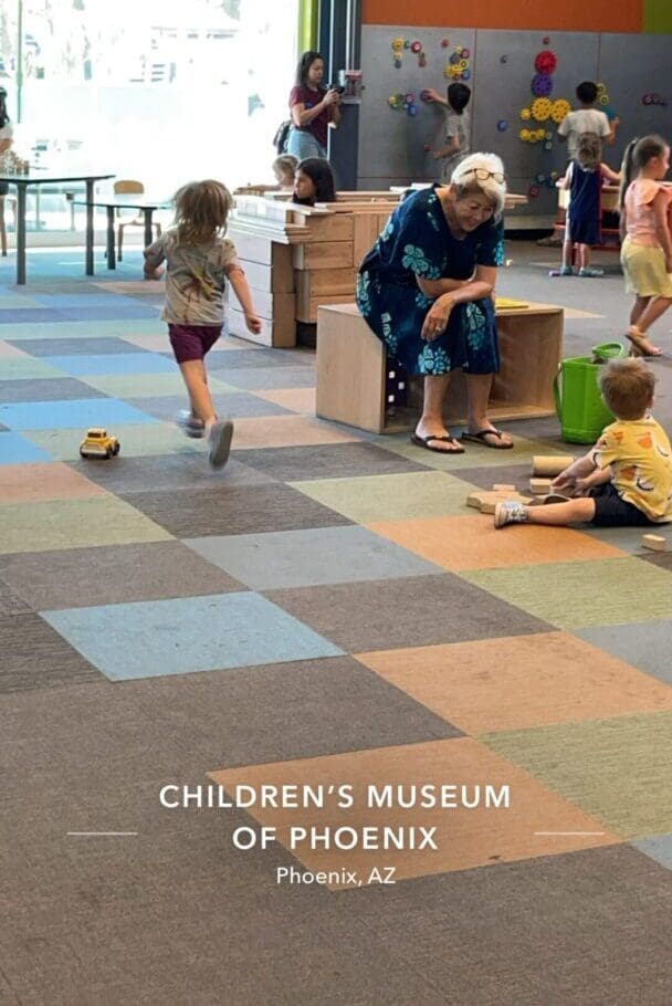 A child plays with toys in an indoor setting.