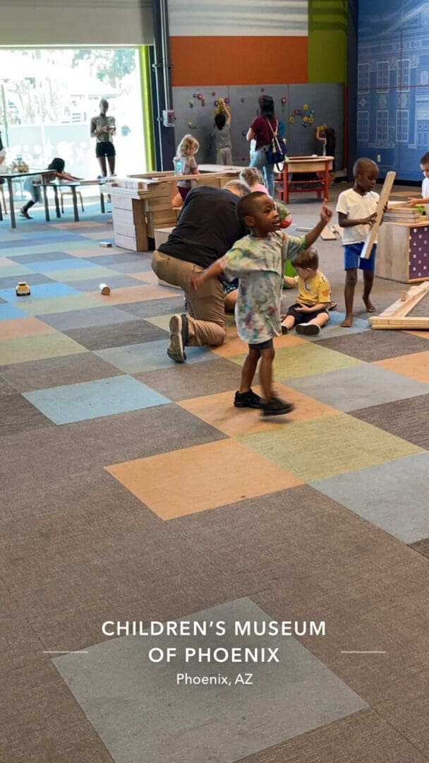 A group of children playing with toys in an indoor setting.